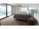 Bedroom with a balcony overlooking city views at 3003 S Atlantic Ave # 17A1, Daytona Beach Shores, FL 32118
