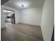 Bright dining room with hardwood floors adjacent to the kitchen with stainless steel refrigerator at 3003 S Atlantic Ave # 17A1, Daytona Beach Shores, FL 32118