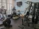 Well-equipped fitness center with treadmills, weights, and large windows offering views at 3003 S Atlantic Ave # 17A1, Daytona Beach Shores, FL 32118