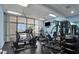Well-equipped fitness center with treadmills, weights, and large windows offering views at 3003 S Atlantic Ave # 17A1, Daytona Beach Shores, FL 32118