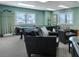 Inviting game room features a billiards table, comfortable seating, and ample natural light at 3003 S Atlantic Ave # 17A1, Daytona Beach Shores, FL 32118