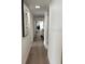 Hallway with luxury vinyl flooring, modern art, and an ocean view at 3003 S Atlantic Ave # 17A1, Daytona Beach Shores, FL 32118
