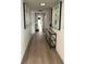 Stylish hallway with modern art and console table, leading to other rooms at 3003 S Atlantic Ave # 17A1, Daytona Beach Shores, FL 32118