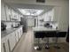 Well-lit kitchen featuring an island with barstool seating at 3003 S Atlantic Ave # 17A1, Daytona Beach Shores, FL 32118