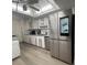 Spacious kitchen with stainless steel refrigerator and ample cabinet storage at 3003 S Atlantic Ave # 17A1, Daytona Beach Shores, FL 32118