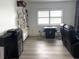 Cozy living room featuring a window with blinds and custom shelving for storage at 3003 S Atlantic Ave # 17A1, Daytona Beach Shores, FL 32118