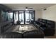 Spacious living room with plush seating and a large sliding glass door with ocean views at 3003 S Atlantic Ave # 17A1, Daytona Beach Shores, FL 32118
