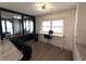 Office area with desk, swivel chair, and sliding glass doors with a view at 3003 S Atlantic Ave # 17A1, Daytona Beach Shores, FL 32118