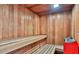 Classic wooden sauna with bench seating, a red heater, and a cozy, warm ambiance at 3003 S Atlantic Ave # 17A1, Daytona Beach Shores, FL 32118