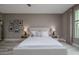 Relaxing bedroom with a comfortable bed, neutral decor, and a view of the outdoors at 3026 Adrian Dr, Ormond Beach, FL 32174