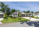 Charming single-story home with a well-manicured lawn, two-car garage, and beautifully landscaped front yard at 3026 Adrian Dr, Ormond Beach, FL 32174