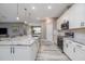 Spacious kitchen featuring stainless steel appliances, granite countertops, white cabinets, and an open layout at 3026 Adrian Dr, Ormond Beach, FL 32174