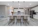 Bright, modern kitchen with an island, granite countertops, stainless steel appliances, and bar stools at 3026 Adrian Dr, Ormond Beach, FL 32174