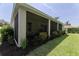 Enjoy the outdoors in this screened lanai, bordered by lush landscaping for privacy and shade at 3026 Adrian Dr, Ormond Beach, FL 32174