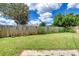 Spacious grassy backyard enclosed by a wooden fence at 31 River Shore Dr, Ormond Beach, FL 32176