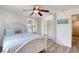 Nicely decorated bedroom with wood-look floors and a closet with shelving at 31 River Shore Dr, Ormond Beach, FL 32176