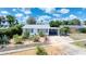 Charming home featuring a xeriscaped front yard and a convenient carport, blending curb appeal with practical design at 31 River Shore Dr, Ormond Beach, FL 32176