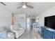 Open-concept living space with a cozy seating area and a dining table next to the kitchen at 31 River Shore Dr, Ormond Beach, FL 32176