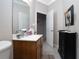 Bathroom featuring a vanity with a white countertop, wood cabinets and modern faucet at 319 Bellingrath Ter, Deland, FL 32724