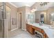 Bright bathroom featuring a vanity with a long countertop and a separate glass door shower at 319 Bellingrath Ter, Deland, FL 32724