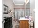 Bathroom featuring a vanity, framed art and a shower with a decorative curtain at 319 Bellingrath Ter, Deland, FL 32724