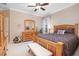 Bedroom featuring a wooden bed frame, dresser with mirror, and plenty of natural light at 319 Bellingrath Ter, Deland, FL 32724