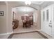 Elegant dining room with a chandelier, wood furniture, and a decorative hutch at 319 Bellingrath Ter, Deland, FL 32724