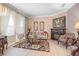 Cozy living room with a fireplace, neutral paint, stylish decor, and plenty of natural light at 319 Bellingrath Ter, Deland, FL 32724