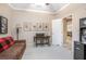 Office space featuring a desk, comfortable sofa and view through an open doorway at 319 Bellingrath Ter, Deland, FL 32724