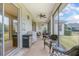 Covered back porch area with patio furniture, ceiling fan, grill and nice views at 319 Bellingrath Ter, Deland, FL 32724