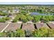 Overhead image of a home near a tranquil lake, surrounded by trees and other houses at 320 W Victoria Trails Blvd, Deland, FL 32724