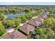 A lovely lake view with several houses nearby at 320 W Victoria Trails Blvd, Deland, FL 32724