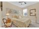 Relaxing bedroom features a ceiling fan, classic furnishings, and soft, ambient lighting at 320 W Victoria Trails Blvd, Deland, FL 32724