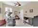 Exercise room boasts an elliptical machine, a chair, and a home office area at 320 W Victoria Trails Blvd, Deland, FL 32724