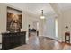 Welcoming foyer with tile floors, console table, and entry to the living room at 320 W Victoria Trails Blvd, Deland, FL 32724