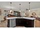 Modern kitchen featuring a center island with a sink, stainless steel appliances and an open floor plan at 320 W Victoria Trails Blvd, Deland, FL 32724
