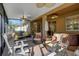 Enclosed lanai features comfortable seating and hot tub, perfect for outdoor enjoyment at 320 W Victoria Trails Blvd, Deland, FL 32724