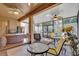 Relaxing screened-in lanai with hot tub, comfortable seating, and multiple ceiling fans at 320 W Victoria Trails Blvd, Deland, FL 32724