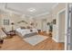 Spacious main bedroom with hardwood floors and tray ceiling at 320 W Victoria Trails Blvd, Deland, FL 32724