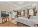 Bright main bedroom with private balcony access and ample natural light at 320 W Victoria Trails Blvd, Deland, FL 32724
