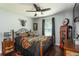 This is a fun bedroom featuring a motorcycle theme and wooden floors at 3210 Whitehorse Ct, Deltona, FL 32738