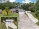 Charming single-story home boasts a well-maintained lawn, long driveway, and attached two-car garage at 3210 Whitehorse Ct, Deltona, FL 32738