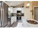 Updated kitchen featuring stainless steel appliances, granite countertops, and a spacious island at 3210 Whitehorse Ct, Deltona, FL 32738