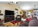 Open-concept living space with cozy seating, fireplace, and seamless flow to dining and kitchen areas at 3210 Whitehorse Ct, Deltona, FL 32738
