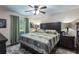 Serene primary bedroom featuring a large bed, soft lighting, and view of the window at 3210 Whitehorse Ct, Deltona, FL 32738