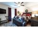 Comfortable main bedroom with large bed, soft carpet, and warm lighting from bedside lamps at 3210 Whitehorse Ct, Deltona, FL 32738