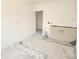 Kitchen being renovated with exposed pipes and unfinished flooring at 327 Frances Ter, Daytona Beach, FL 32118