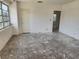 Empty living room with large windows and a doorway to the adjacent room at 327 Frances Ter, Daytona Beach, FL 32118