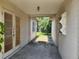Covered passageway leads from the garage into the backyard with brick flooring at 327 Frances Ter, Daytona Beach, FL 32118