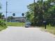 Scenic street view featuring lush greenery, bridge and tranquil waterfront in the distance at 327 Frances Ter, Daytona Beach, FL 32118